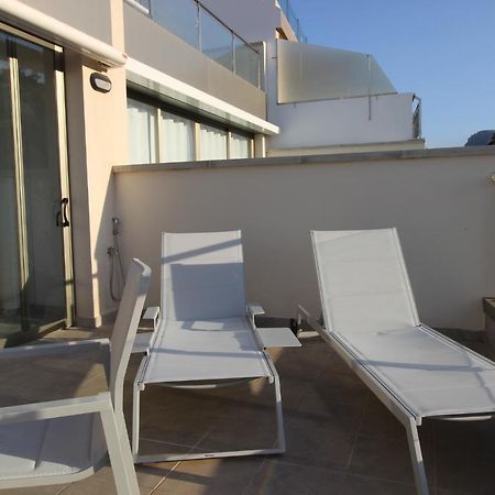 Sun, Sea And Rocks Apartment ปวยร์โต เด มอแกน ภายนอก รูปภาพ