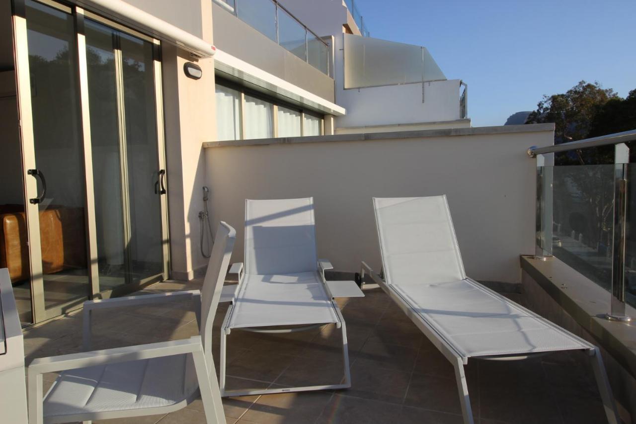 Sun, Sea And Rocks Apartment ปวยร์โต เด มอแกน ภายนอก รูปภาพ